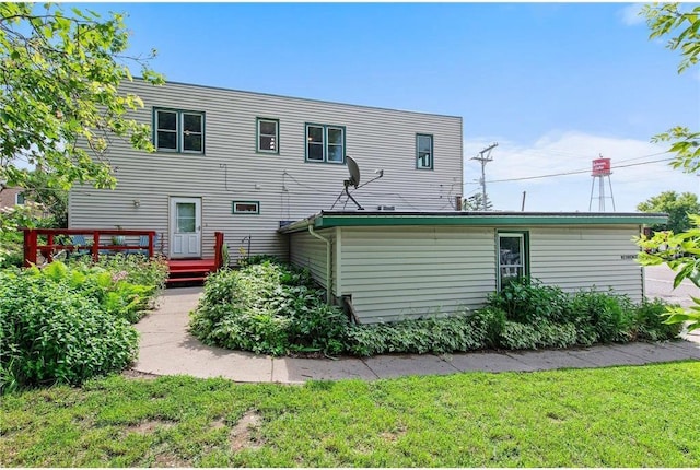 110 1st Ave, Balsam Lake, WI 54810 - back of property with a wooden deck and a yard