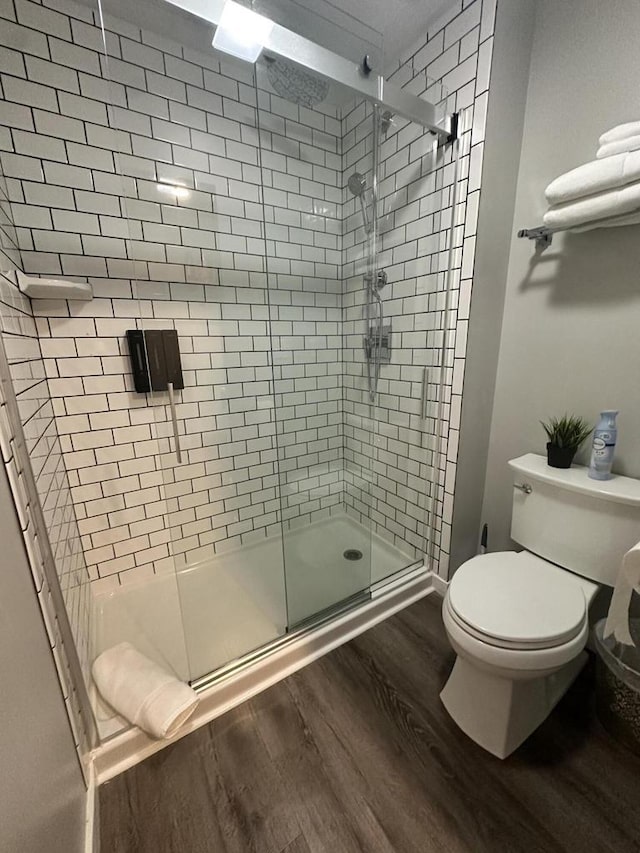 266 Victorian Village Dr Unit 226, Elkhart Lake, WI 53020 - full bathroom featuring wood finished floors and a shower stall