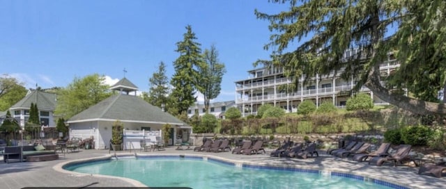 266 Victorian Village Dr Unit 226, Elkhart Lake, WI 53020 - community pool featuring a patio