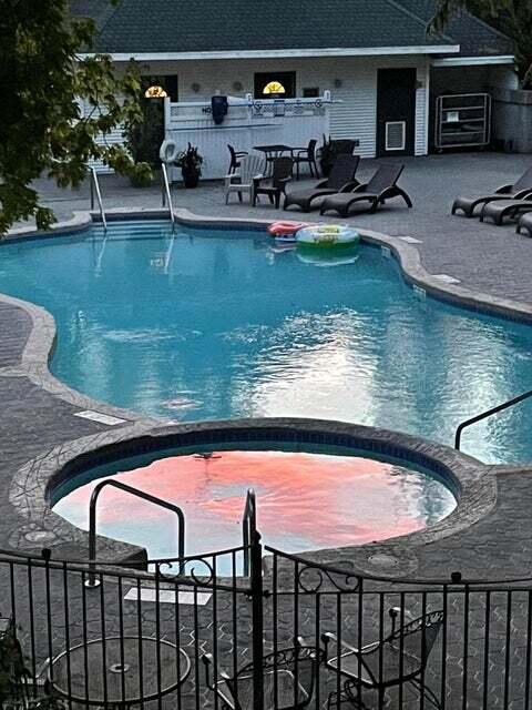 266 Victorian Village Dr Unit 226, Elkhart Lake, WI 53020 - view of swimming pool with a patio and a pool with connected hot tub