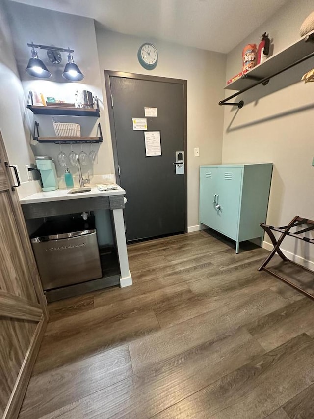 266 Victorian Village Dr Unit 226, Elkhart Lake, WI 53020 - entryway featuring dark wood-type flooring and baseboards