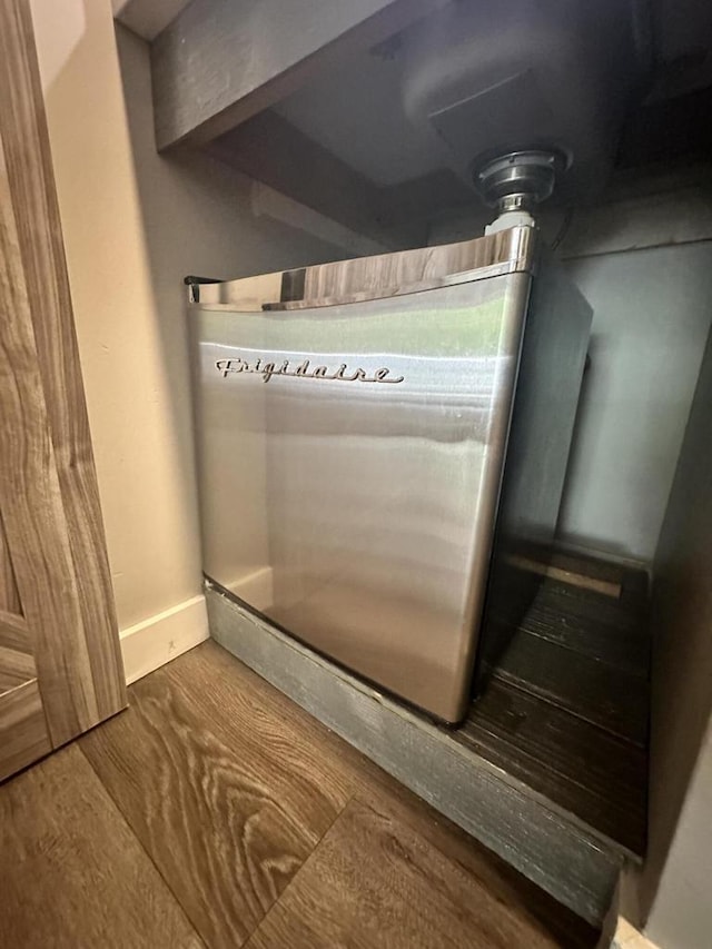 266 Victorian Village Dr Unit 226, Elkhart Lake, WI 53020 - detailed view of wood finished floors and baseboards