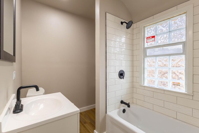 4366 N 25th St, Milwaukee, WI 53209 - bathroom featuring shower / tub combination, wood finished floors, and vanity