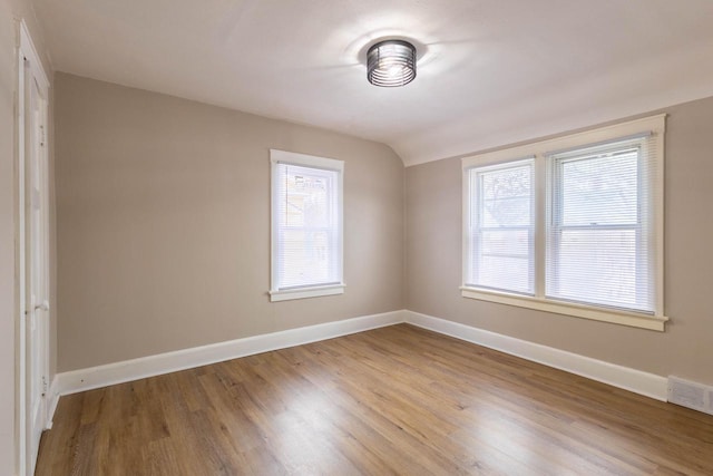 4366 N 25th St, Milwaukee, WI 53209 - empty room featuring wood finished floors and lofted ceiling