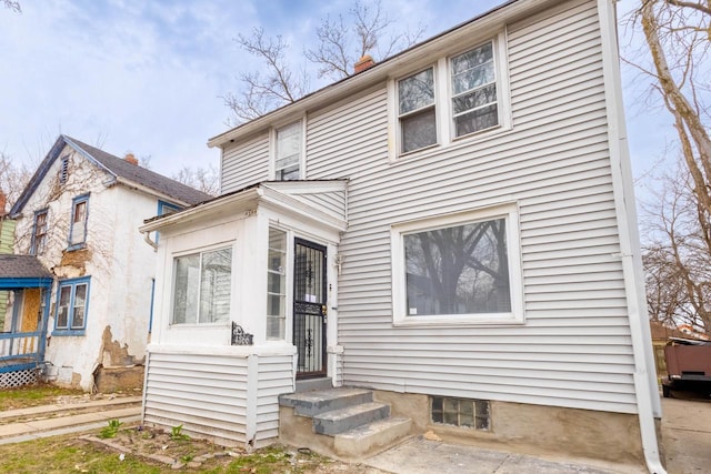 4366 N 25th St, Milwaukee, WI 53209 - view of front facade featuring a chimney