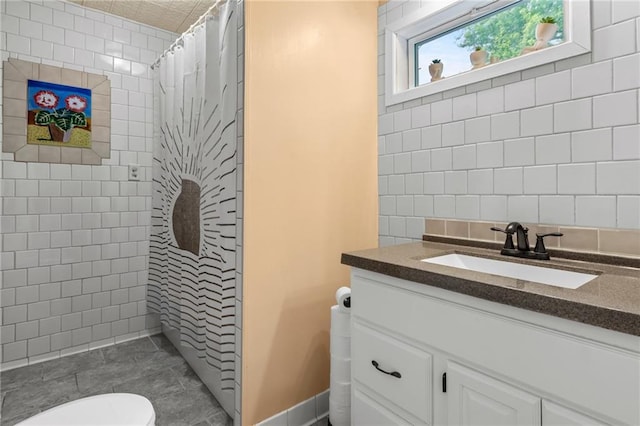 110 1st Ave, Balsam Lake, WI 54005 - full bath featuring vanity, a tile shower, and tile walls