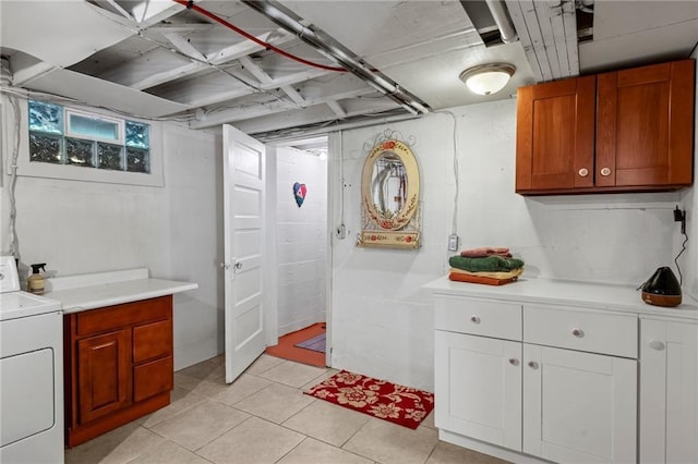 110 1st Ave, Balsam Lake, WI 54005 - laundry area featuring washer / dryer, cabinet space, and light tile patterned floors