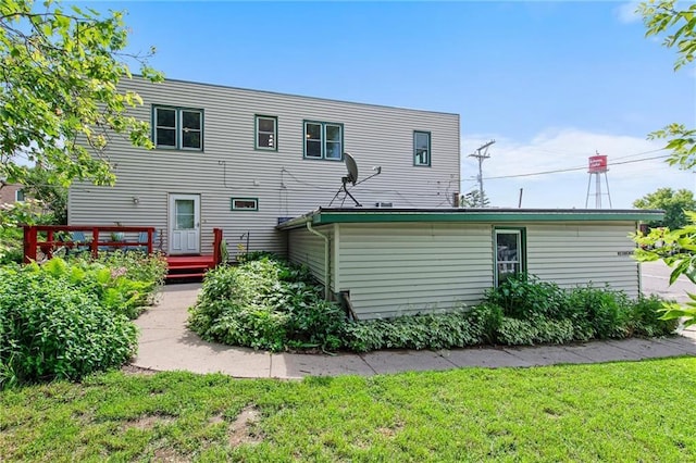 110 1st Ave, Balsam Lake, WI 54005 - rear view of property with a yard and a wooden deck