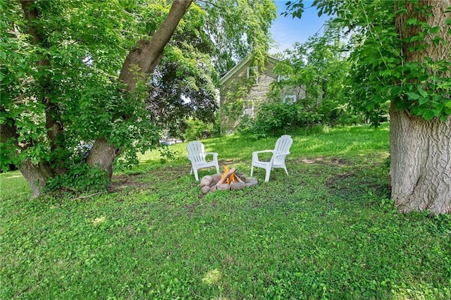 110 1st Ave, Balsam Lake, WI 54005 - view of grassy yard with an outdoor fire pit