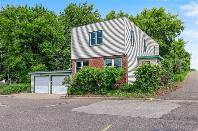 110 1st Ave, Balsam Lake, WI 54005 - view of front of house with brick siding