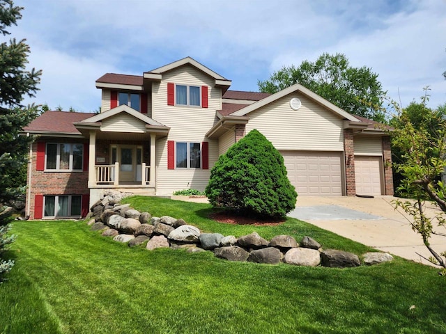 4205 Monarch Ct, Middleton, WI 53562 - view of front of house with driveway, an attached garage, a front yard, and brick siding