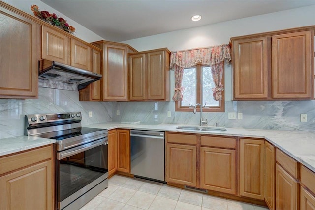4205 Monarch Ct, Middleton, WI 53562 - kitchen featuring stainless steel appliances, extractor fan, light countertops, and decorative backsplash