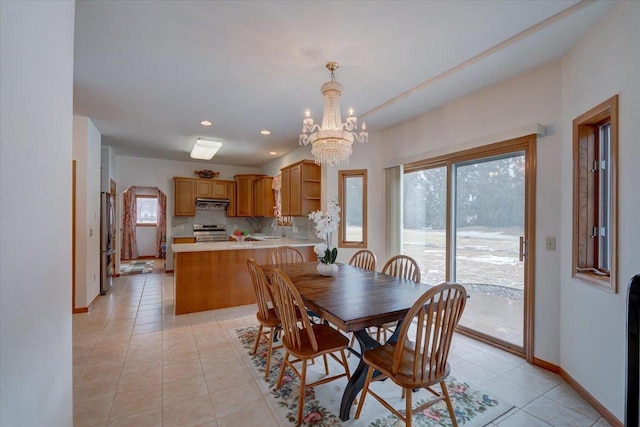 4205 Monarch Ct, Middleton, WI 53562 - dining room featuring a chandelier, light tile patterned floors, and recessed lighting