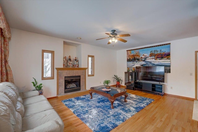 4205 Monarch Ct, Middleton, WI 53562 - living area featuring ceiling fan, wood finished floors, and a tile fireplace
