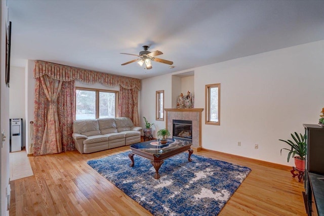 4205 Monarch Ct, Middleton, WI 53562 - living room with ceiling fan, light wood-type flooring, and a tiled fireplace