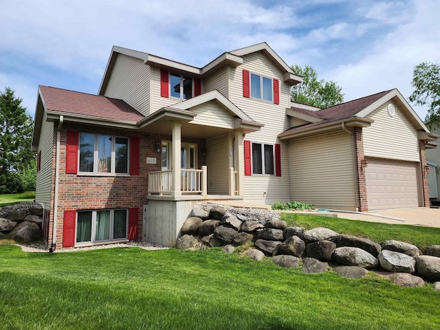 4205 Monarch Ct, Middleton, WI 53562 - view of front of home featuring covered porch, a front lawn, concrete driveway, and brick siding