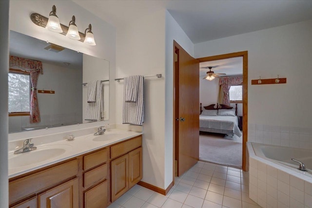 4205 Monarch Ct, Middleton, WI 53562 - ensuite bathroom with double vanity, tiled bath, tile patterned floors, and a ceiling fan