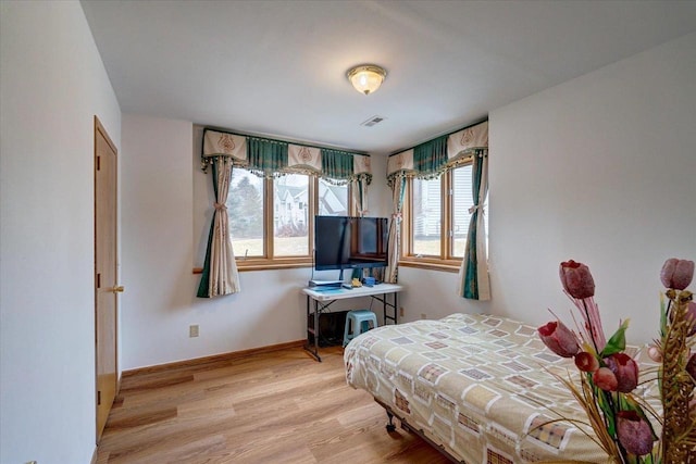4205 Monarch Ct, Middleton, WI 53562 - bedroom with multiple windows and wood finished floors