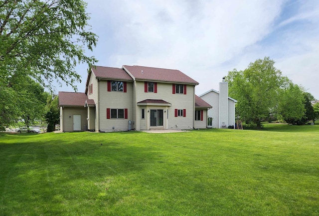 4205 Monarch Ct, Middleton, WI 53562 - rear view of house with a lawn, a patio area, and a chimney