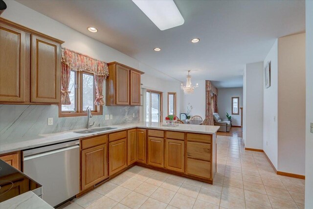 4205 Monarch Ct, Middleton, WI 53562 - kitchen featuring dishwasher, a peninsula, plenty of natural light, and recessed lighting