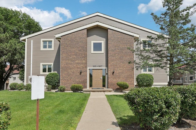 1603 Mckenna Blvd, Madison, WI 53711 - view of front facade featuring a front lawn and brick siding