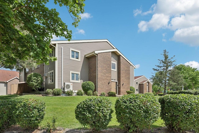 1603 Mckenna Blvd, Madison, WI 53711 - view of side of property with brick siding and a yard