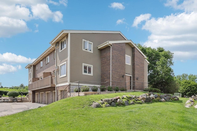 1603 Mckenna Blvd, Madison, WI 53711 - view of building exterior with a garage and driveway