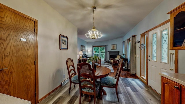 654 Riverview Ct Unit 2-Bldg C, Jefferson, WI 53549 - dining space with dark wood-type flooring and a chandelier