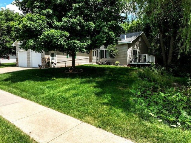 654 Riverview Ct Unit 2-Bldg C, Jefferson, WI 53549 - view of front facade with a front yard, a garage, and a deck