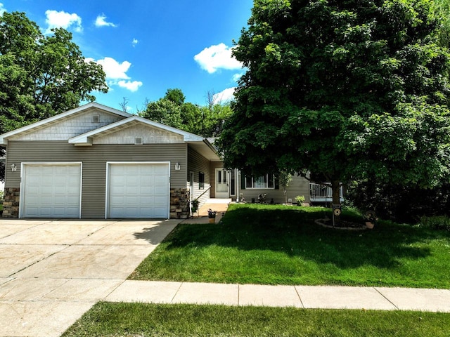 654 Riverview Ct Unit 2-Bldg C, Jefferson, WI 53549 - ranch-style home with a garage, concrete driveway, stone siding, and a front yard