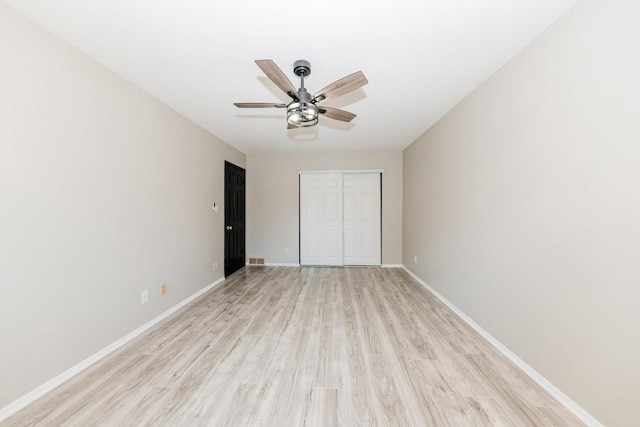 W169N11492 Biscayne Dr, Germantown, WI 53022 - unfurnished bedroom with a closet, light wood-type flooring, and ceiling fan