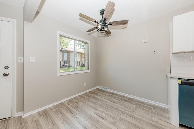 W169N11492 Biscayne Dr, Germantown, WI 53022 - unfurnished dining area with light wood-style flooring and a ceiling fan