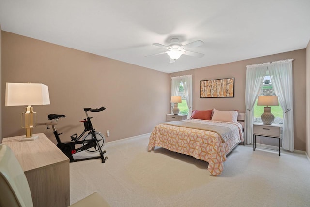N52W35297 Lighthouse Ln, Oconomowoc, WI 53066 - bedroom with light colored carpet and ceiling fan