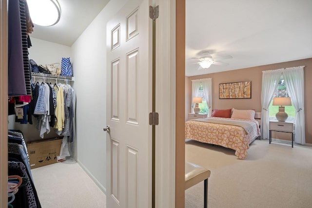 N52W35297 Lighthouse Ln, Oconomowoc, WI 53066 - bedroom with carpet floors, multiple windows, and ceiling fan