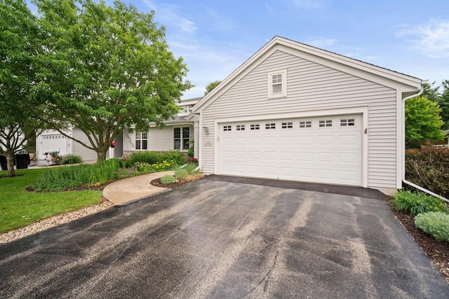 N52W35297 Lighthouse Ln, Oconomowoc, WI 53066 - ranch-style home with driveway and an attached garage