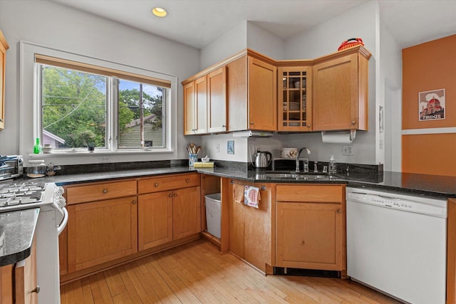 4069 N Prospect Ave, Shorewood, WI 53211 - kitchen featuring white appliances, light wood-type flooring, glass insert cabinets, recessed lighting, and dark stone counters