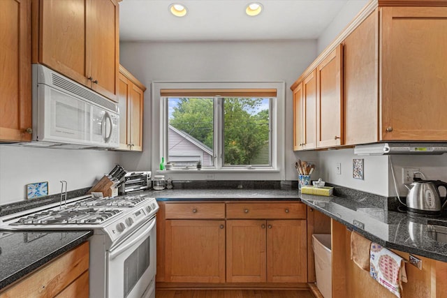 4069 N Prospect Ave, Shorewood, WI 53211 - kitchen featuring white appliances, recessed lighting, and dark stone counters