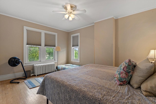 4069 N Prospect Ave, Shorewood, WI 53211 - bedroom featuring radiator heating unit, hardwood / wood-style flooring, crown molding, and ceiling fan