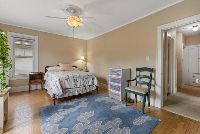 4069 N Prospect Ave, Shorewood, WI 53211 - bedroom featuring hardwood / wood-style flooring, ornamental molding, and a ceiling fan