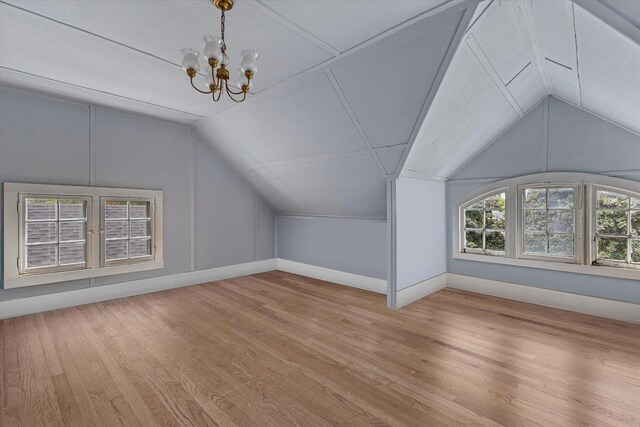 4069 N Prospect Ave, Shorewood, WI 53211 - bonus room featuring a chandelier, lofted ceiling, and wood finished floors