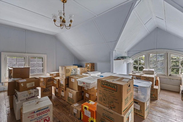 4069 N Prospect Ave, Shorewood, WI 53211 - additional living space with vaulted ceiling, hardwood / wood-style floors, and a chandelier