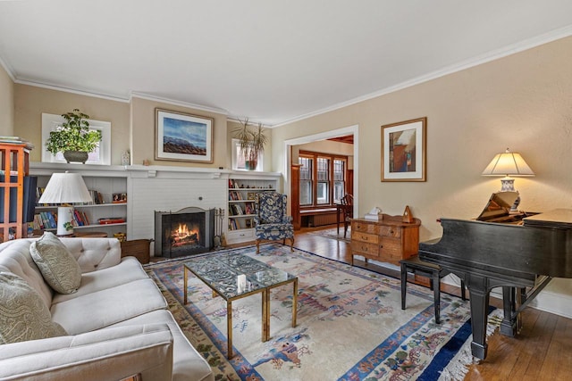 4069 N Prospect Ave, Shorewood, WI 53211 - living area featuring hardwood / wood-style floors, ornamental molding, and a fireplace