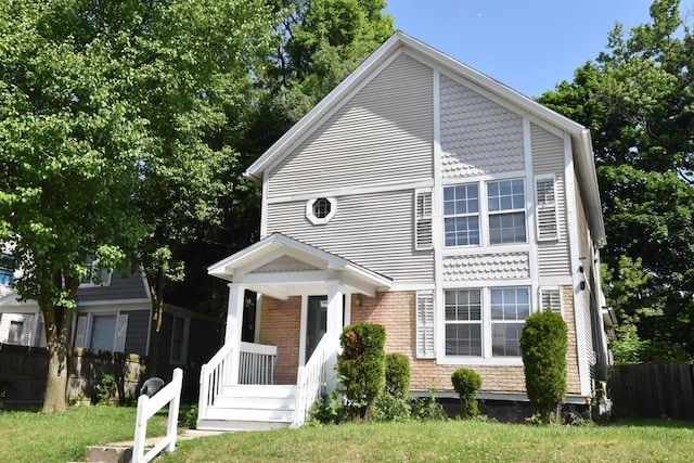 1600 Winslow St, Racine, WI 53404 - view of front facade with brick siding and a porch