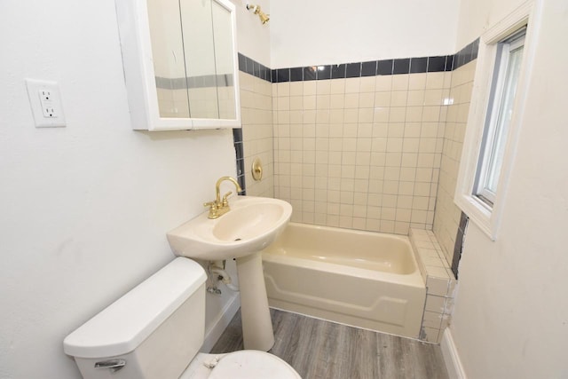 1600 Winslow St, Racine, WI 53404 - bathroom with wood finished floors and shower / washtub combination