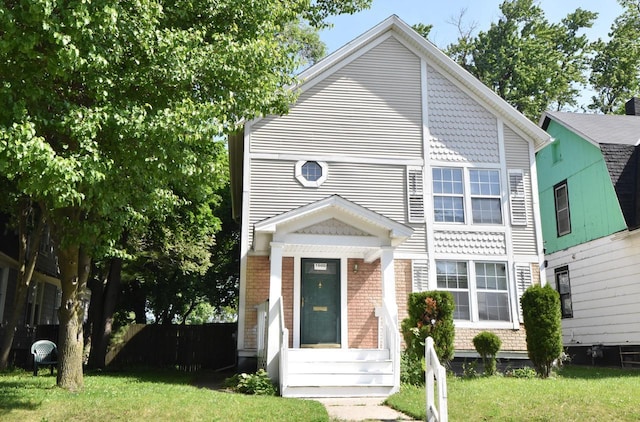 1600 Winslow St, Racine, WI 53404 - view of front of house with a front lawn and brick siding