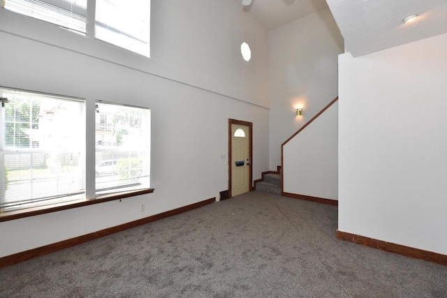1600 Winslow St, Racine, WI 53404 - empty room with a towering ceiling, carpet floors, and stairs