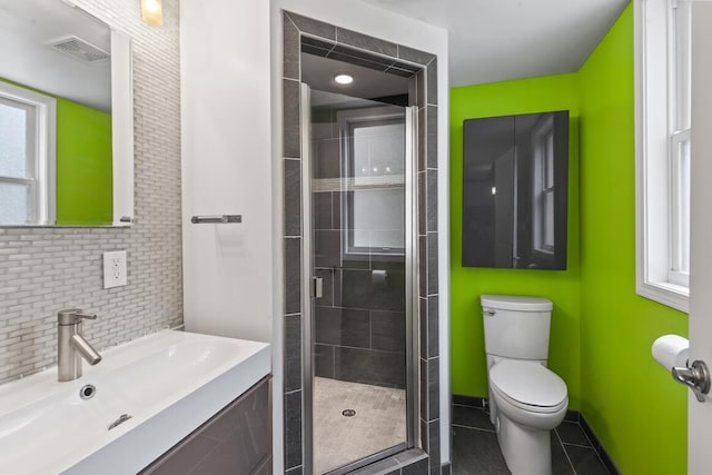 1853 N 83rd St, Wauwatosa, WI 53213 - full bathroom with a stall shower, vanity, tile patterned flooring, and backsplash