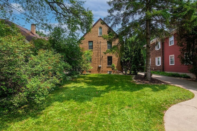 1853 N 83rd St, Wauwatosa, WI 53213 - view of front of property featuring a front yard and brick siding
