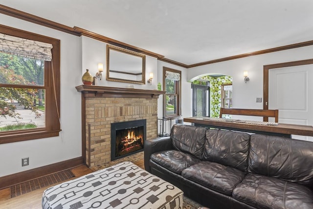 1853 N 83rd St, Wauwatosa, WI 53213 - living room with wood finished floors, ornamental molding, and a fireplace