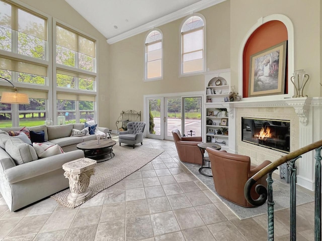 2307 W Willow Creek Ln, Sheboygan, WI 53083 - living room with high vaulted ceiling, healthy amount of natural light, built in features, a fireplace, and crown molding